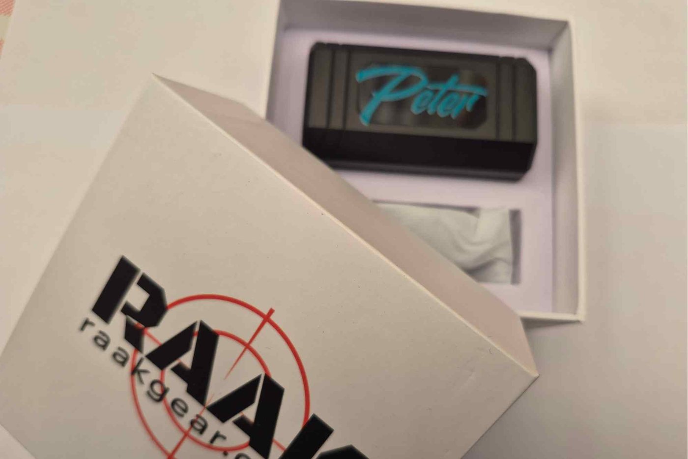 BL03 charging case with a name printed on it